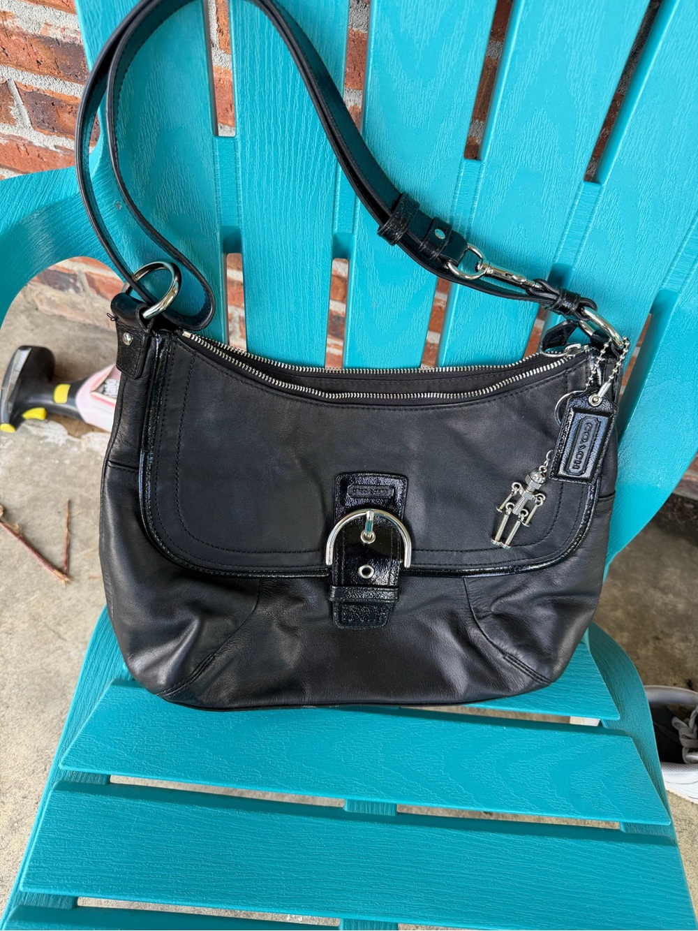 Coach Black Leather Shoulder Bag with Buckle and Charm